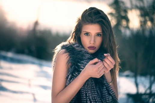Beautiful Glamour Girl with Pretty Lips in the Winter Forest